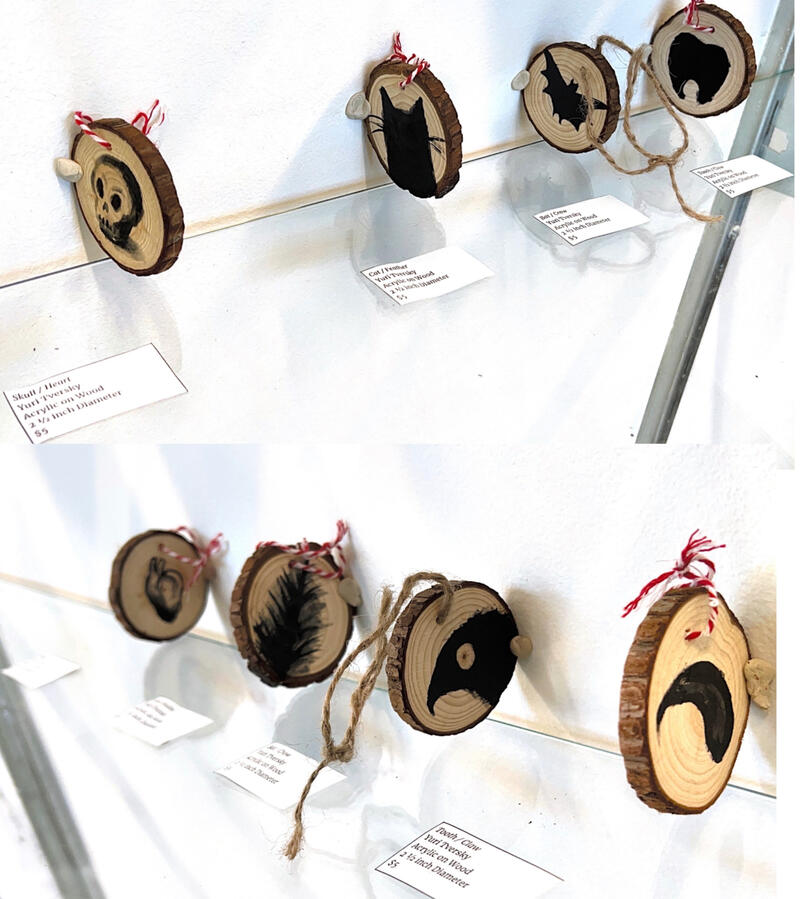 Leftmost: "Skull/Heart" by Yuri Tversky, Acrylic on Wood, 2 1/2 inch Diameter, $5 + Shipping; Second from the Left: "Cat/Feather"; Second from the Right: "Bat/Crow"; Rightmost: "Tooth/Claw"